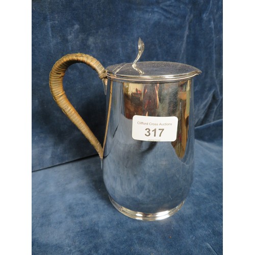 317 - A large silver plated hot water/milk jug by James Dixon & Sons, Sheffield with woven handle.