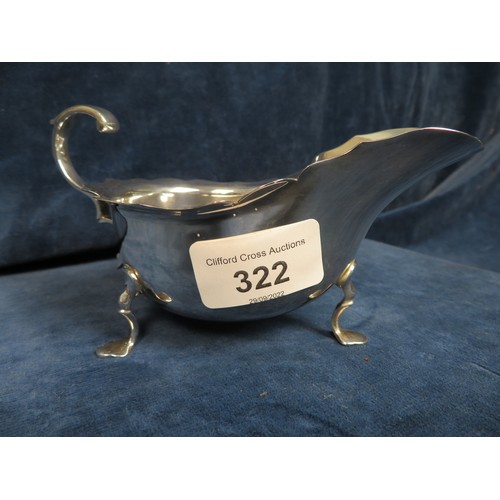 322 - A silver sauce boat on three splayed feet hallmarked Sheffield 1911 weighing approx/ 3.5 troy oz.