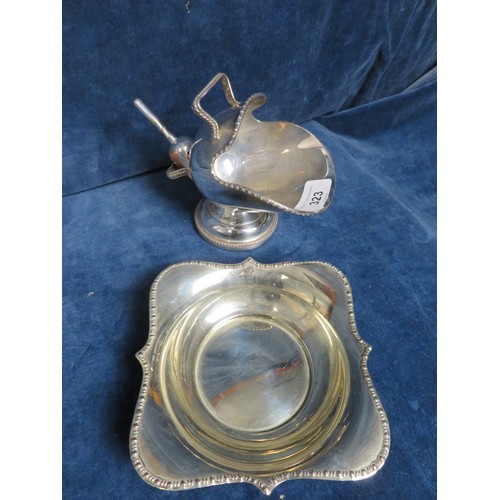 323 - A silver plated scuttle shaped sugar basin and dish.