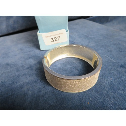 327 - A silver plated bangle.