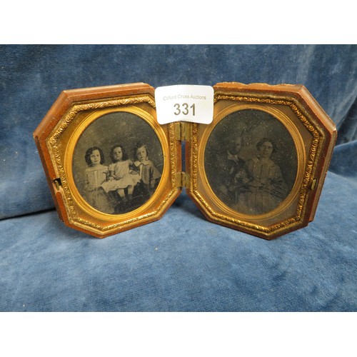 331 - A late Victorian family daurgerotype depicting husband and wife and three children in original papie... 