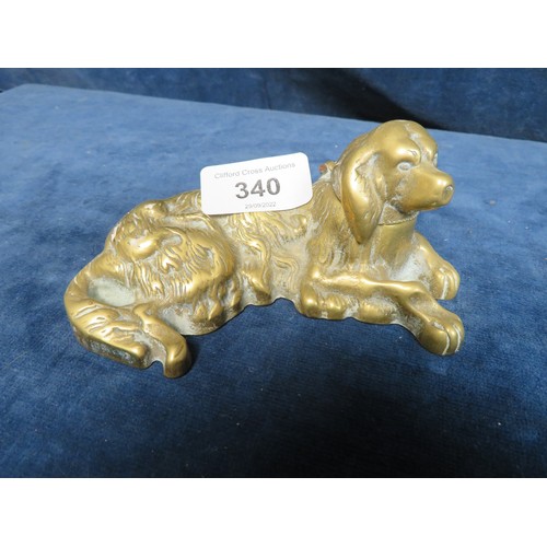 340 - A late 19th century cast brass laying spaniel inkwell (porcelain liner missing)