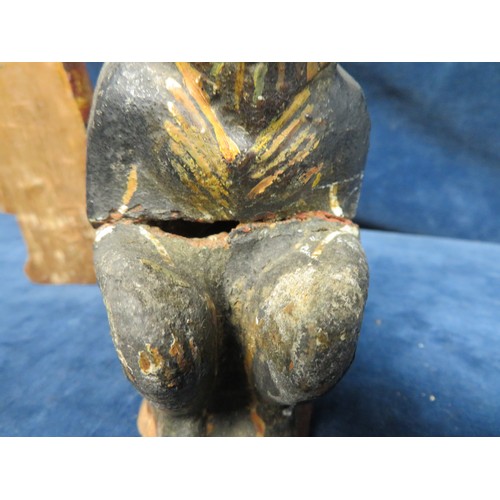 345 - A most unusual stoneware primitive style figurine depicting a seated figure in lion mask A/F and a m... 