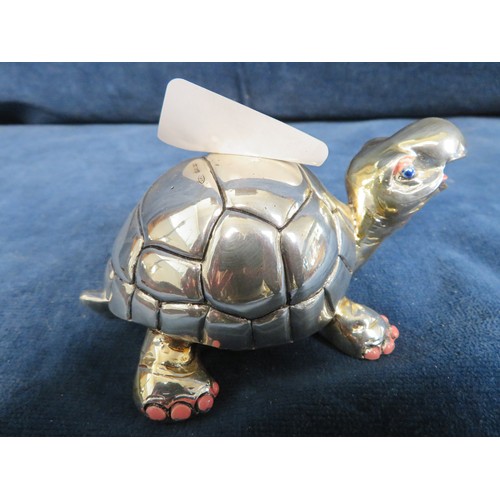 383 - A tortoise paperweight marked Sterling 