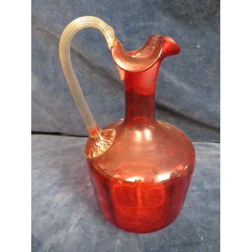 394 - A Victorian Cranberry glass jug.