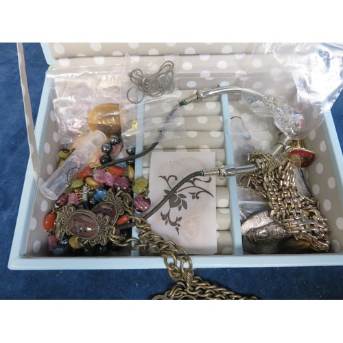 402 - A quantity of costume and other jewellery in box.