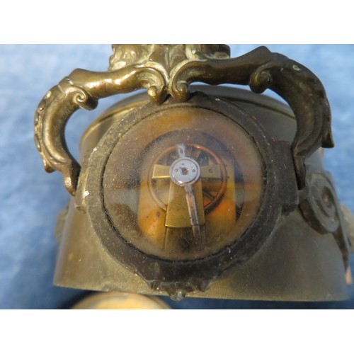 409 - A mantel clock in brass case with lion head handles, stamped 