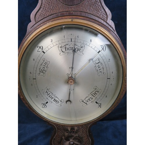 411 - A vintage banjo barometer in carved case - glass A/F.