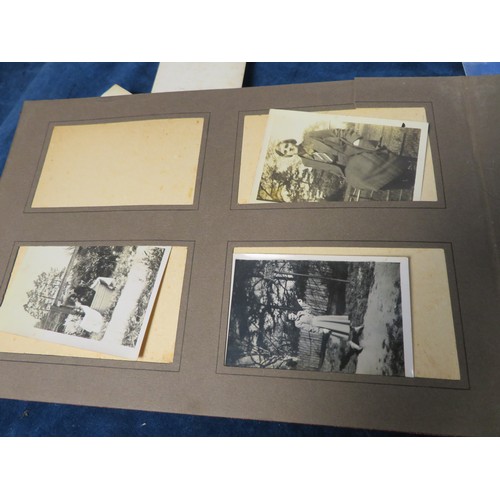 455 - A vintage photograph album with various vintage photographs .