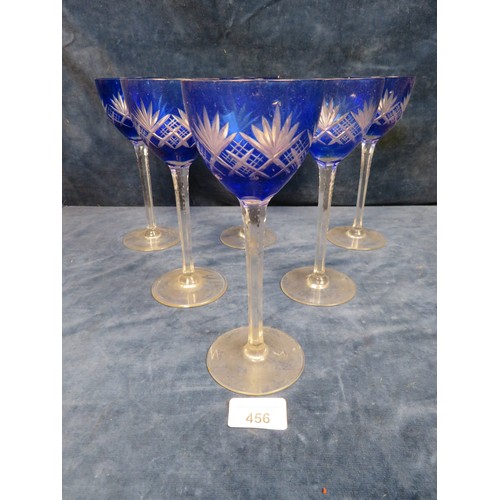 456 - A set of 6 blue cut glass pedestal wine glasses.