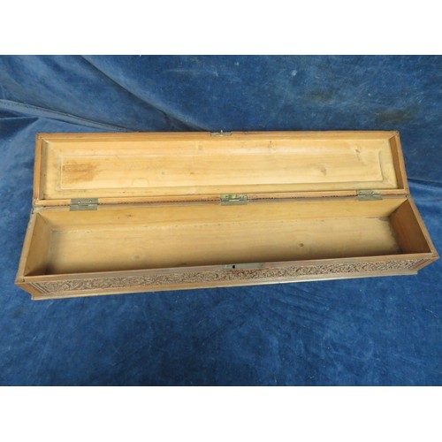 467 - An ornately carved Sandal Wood box, 48cm long x 10cm wide and 8cm high with key, some missing beadin... 