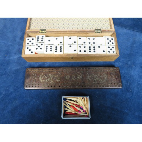 476 - A set of vintage dominoes in box with pegboard lid, together with pegboard and domino pegs.