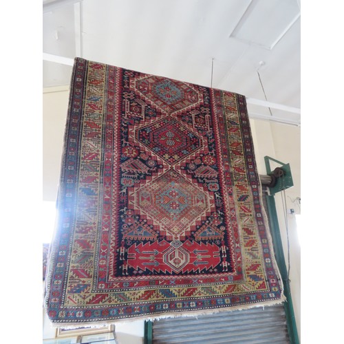 489 - A large Eastern rug, approximately 320cm x 135cm.