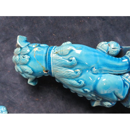 490 - Three blue glazed Oriental style Fu Dogs A/F.