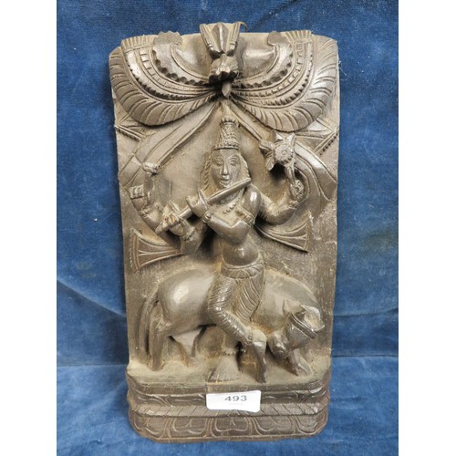 493 - A carved wooden wall plaque depicting Asian style musician and bull.