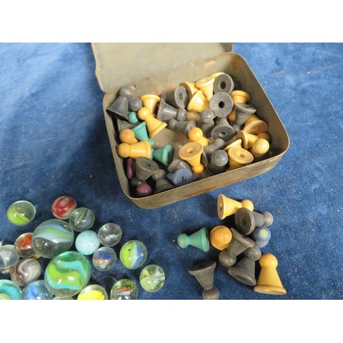 494 - A quantity of vintage marbles and game counters.