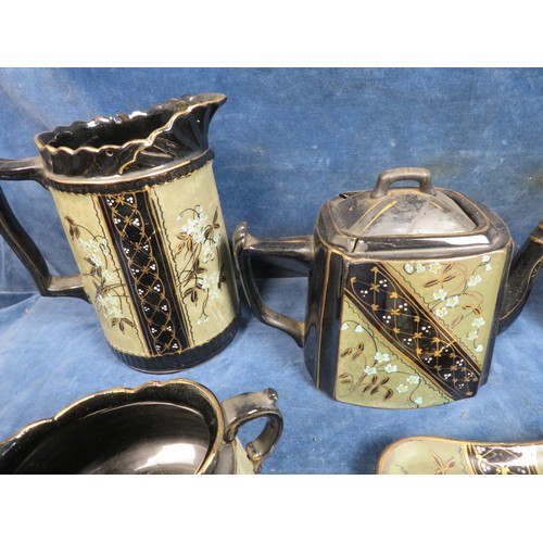 495 - A Victorian Locks Ltd Tea and Coffee set with black ground and gilt and floral spray decoration comp... 