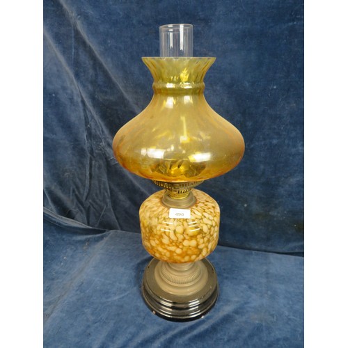 496 - A vintage oil lamp with amber and white flecked glass reservoir, amber glass shade, Duplex burner an... 