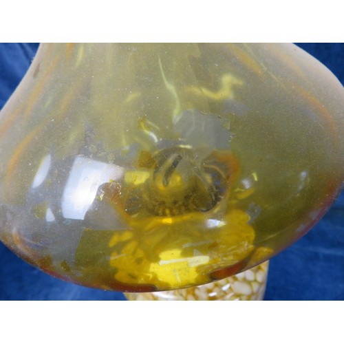 496 - A vintage oil lamp with amber and white flecked glass reservoir, amber glass shade, Duplex burner an... 