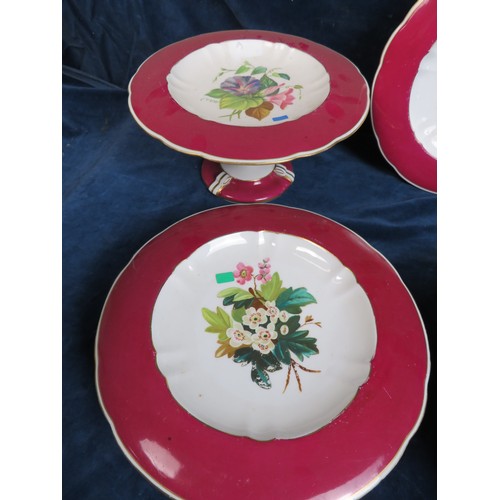 498 - A part dessert service with pink ground and hand-painted floral decoration comprising 5 comportes an... 