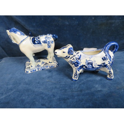 516 - A Delft Ware Unicorn (A/F) and a Delft Ware Cow Creamer.