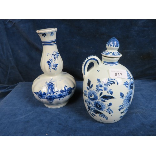 517 - A Delft ware bottle with cork stopper and a musical Delft ware bottle with cork stopper (A/F).