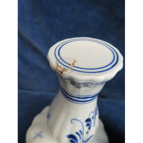 517 - A Delft ware bottle with cork stopper and a musical Delft ware bottle with cork stopper (A/F).