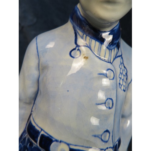 518 - A Delft Ware figure of a Clogged Dutchman marked 