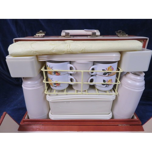 554 - A vintage 'Brexton' picnic case with original fittings (no caps for the flasks).