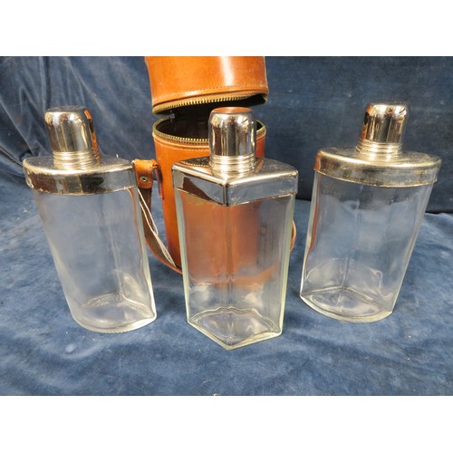 555 - A Dupont Finess 3-section drinks flask with glass and metal flasks in leather case.