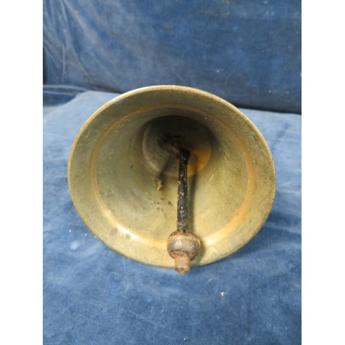 556 - A brass hand-bell with turned wooden handle.