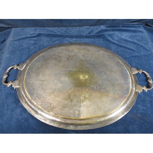 558 - A large silver-plated 2-handled oval serving tray being 61.5cm x 49.5cm.