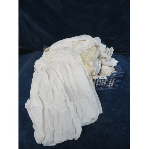 566 - A quantity of vintage linen children's dresses, etc.,