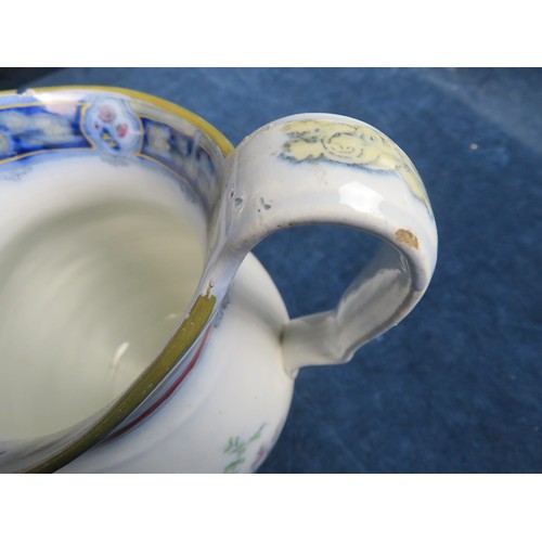 604 - An 'East Anglia Empire Ware' blue and white jug, a blue and white covered jar and another jug.