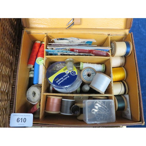 610 - A wicker basket, sewing box and contents.