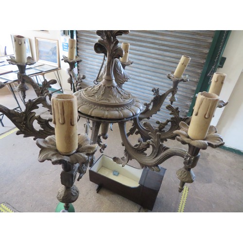 613 - A vintage eight branch metal chandelier.