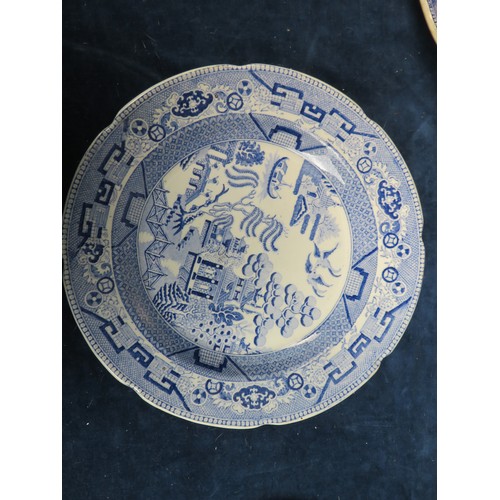 617 - Seven 19th century stoneware willow pattern platters and plates together with a 1959 llangowlen eist... 