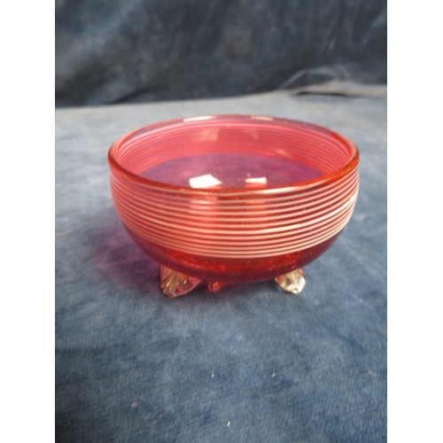 622 - Four pieces of cranberry glass being small heart shaped dish on shell style feet, cream jug on shell... 