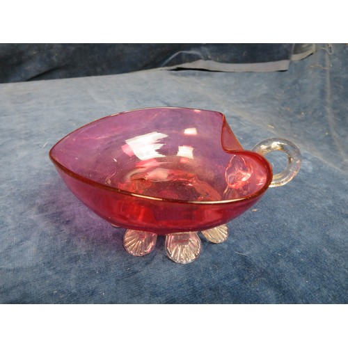 622 - Four pieces of cranberry glass being small heart shaped dish on shell style feet, cream jug on shell... 