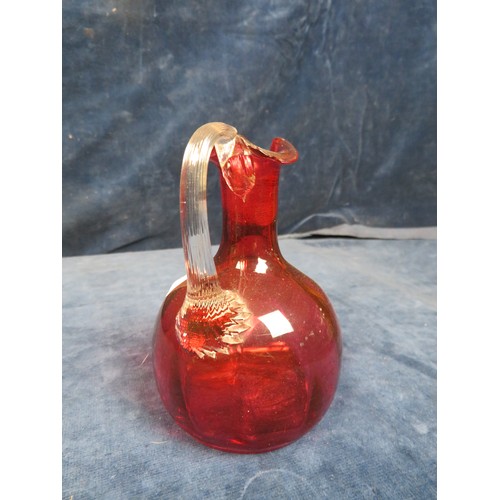 622 - Four pieces of cranberry glass being small heart shaped dish on shell style feet, cream jug on shell... 