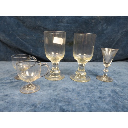 633 - Two early 19th century pedestal rummer glasses with faceted stems, 15cm tall (one with chip to rim) ... 