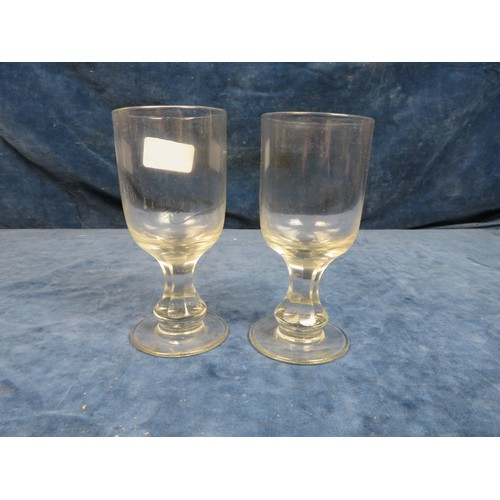 633 - Two early 19th century pedestal rummer glasses with faceted stems, 15cm tall (one with chip to rim) ... 