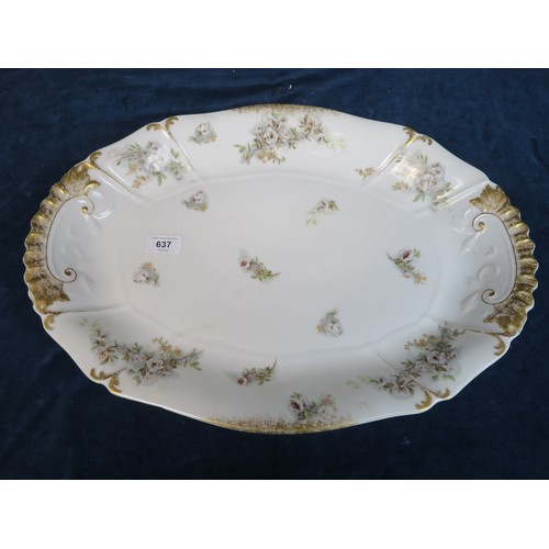 637 - A large Limoges oval platter measuring 50cm x 36cm with floral decoration and gilt highlights.