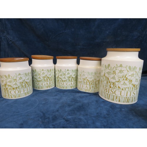 643 - Seven pieces of Hornsea Fleur pattern comprising biscuit jar, 2 sugar jars, tea and coffee jar, all ... 