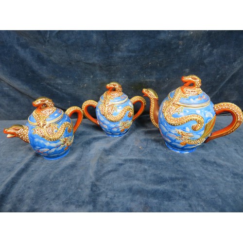 665 - An Japanese satsuma porcelain tea set with dragon handles and blue ground and dragon decoration comp... 