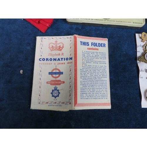 674 - A quantity of coronation brooches, tins, and other Royal memorabilia including two linen Union Jacks... 