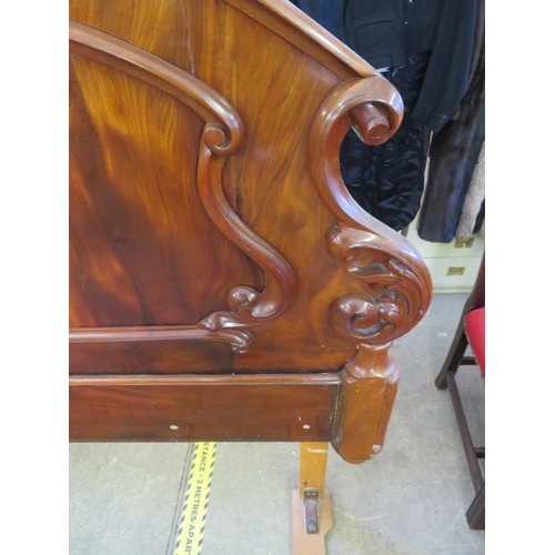 744 - A ornate walnut double bed headboard - 145cm x 135cm tall.