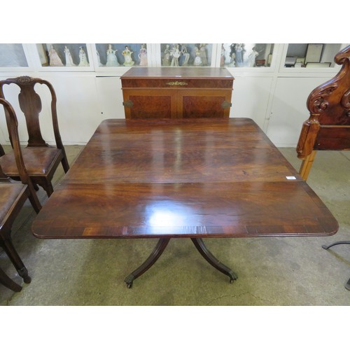 746 - An antique mahogany pedestal drop leaf table with single drawer on 4 splayed legs with brass claw fe... 