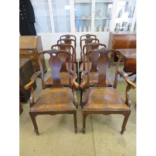 748 - A set of 8 early 20th century dining chairs being 2 carvers and 6 single with shaped back panels and... 