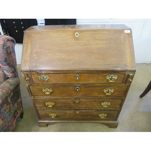 751 - An antique mahogany bureau desk with fitted interior  and 4 drawers on bracket feet and brass drop h... 